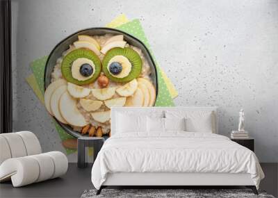 Kids breakfast porridge look like cute owl with fruits and nuts Wall mural