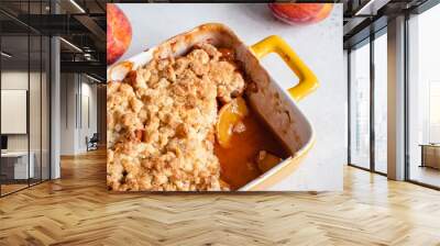 Peach cobbler dessert in a baking dish Wall mural