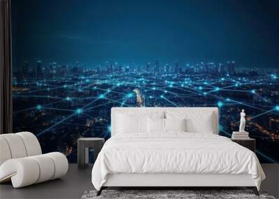 Cityscape at night with glowing lines connecting buildings. Wall mural