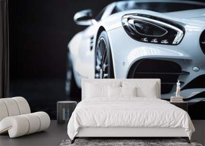 Close-up of a white sports car's front end, showcasing the sleek design and powerful headlights. Wall mural