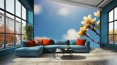 Fresh spring blue bright sky background with flowers and hazy warm bright light. Wall mural