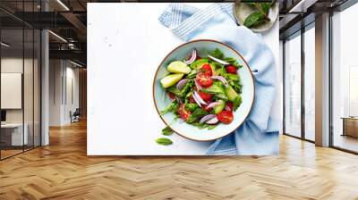 Mixed salad made with cherry tomatoes, arugula, red onion, avocado and mint leaves. Healthy home made food. Flat lay. Copy space Wall mural