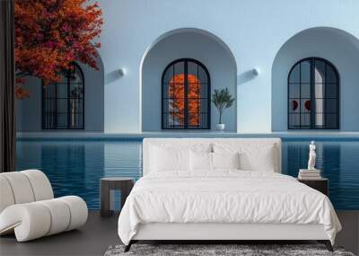 Elegant architecture with a serene pool reflecting autumn colors and striking minimalism, creating a tranquil atmosphere. Wall mural