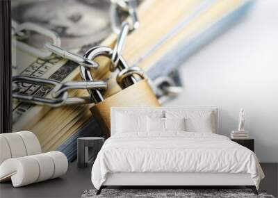 Business safety or financial protection or restriction access. Heap of money in chain with padlock isolated on white Wall mural