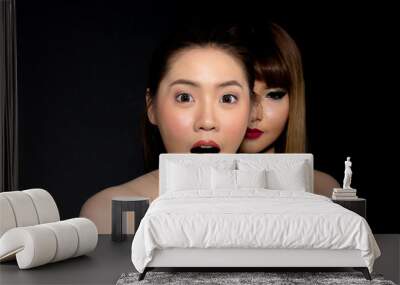 Asian lesbian couple isolated on black background with copy space. Wall mural