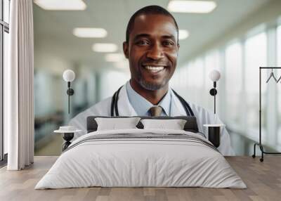 Portrait of a smiling middle aged male doctor in hospital Wall mural