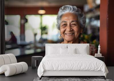 Smiling portrait of a happy senior Mexican woman in nursing home Wall mural