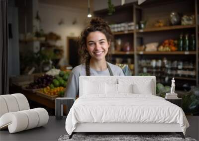 Smiling young woman working in a healthy food store Wall mural