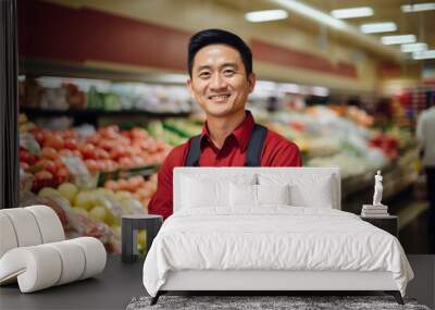 Young male asian supermarket manager or worker working in a supermarket or grocery store Wall mural