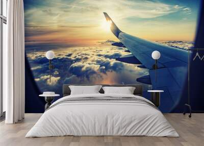 flying and traveling,  view from airplane window on the wing on sunset time  Wall mural