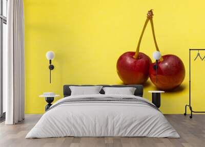 two cherry on yellow background Wall mural