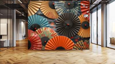 A collection of paper fans with different colors and designs Wall mural