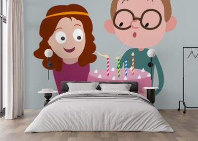 Boy and girl holding cake: boy blowing out candles: Birthday concept Wall mural