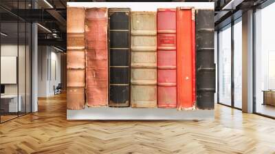 A stack of beautiful leather bound old vintage books with golden decoration isolated on white background. Wall mural