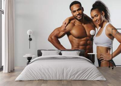 Athletic man and woman isolated over white background, happy man and woman back to back smiling and posing to the camera, copy space. Personal fitness instructor. Personal training. Wall mural