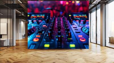 Music controller DJ mixer in a nightclub at a party in front of group of high people, neon light backgrounds. Wall mural