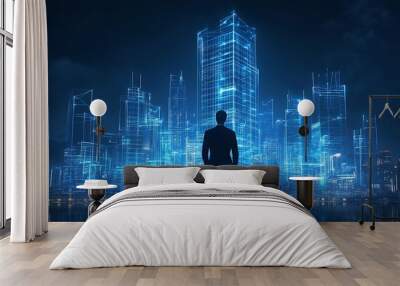 A silhouette of a person stands before a futuristic cityscape illuminated by blue digital lights. Wall mural