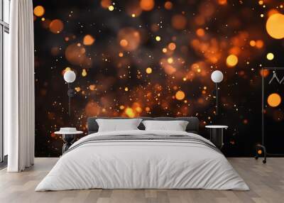 A vibrant display of glowing orange particles against a dark background, creating a dynamic and energetic atmosphere. Wall mural