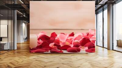 Valentine's Day banner with two lit candles and scattered rose petals Wall mural