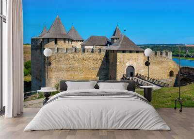 Photo of ancient stone castle with many hight towers in Khotym Wall mural