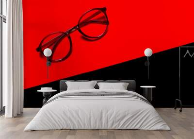 glasses isolated on red and black background Wall mural