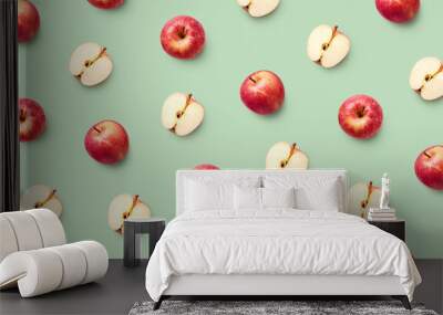 Colorful fruit pattern of fresh red apples on green background Wall mural