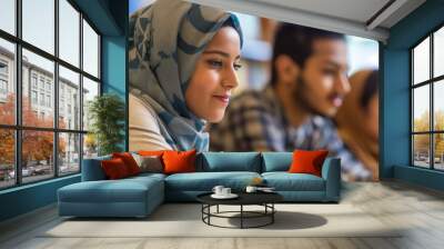 A group of students from different cultures study together in the library. The concept of education and diversity Wall mural