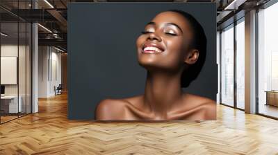 A joyful, elegant woman with delicate and flawless skin. Wall mural