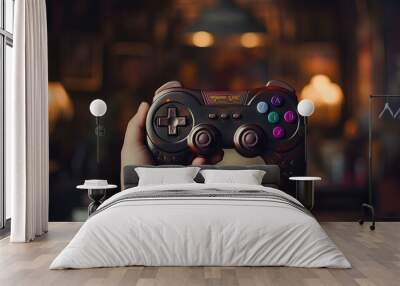 Hands holding a gamepad, a joystick for a video game console. Wall mural