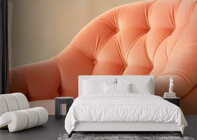 The upholstered armchair is a close-up in delicate shades of peach fuzz, the color of the year 2024. Wall mural