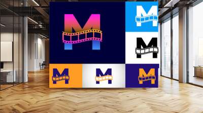 Initial M monogram alphabet incorporated with film reel. Video and movie logo concept. Font emblem. Logo for the entertainment business and company identity Wall mural