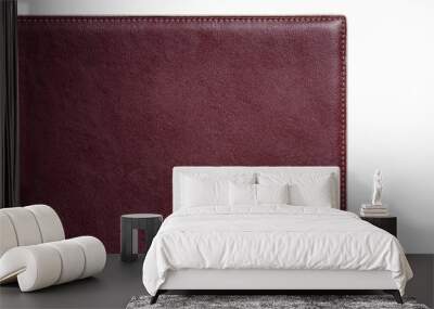 Dark-red fine texture of genuine leather. Close-up edge isolated at white background Wall mural