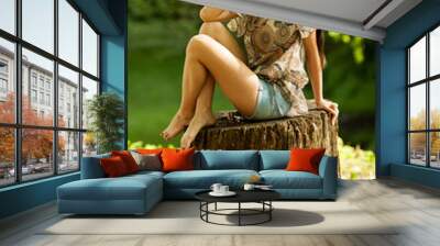 Attractive female relaxing in nature Wall mural