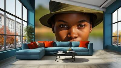 close-up portrait of a young african man in a safari hat Wall mural