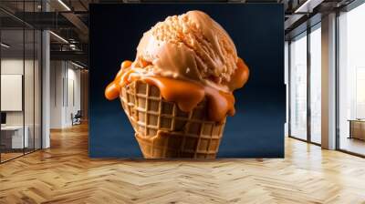 Delicious scoop of creamy orange ice cream in a waffle cone Wall mural