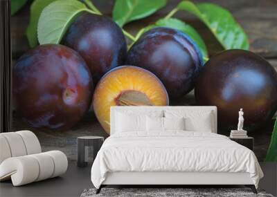 Fresh plums on wooden background Wall mural