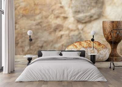 Freshly baked bread with wooden cup on rustic background Wall mural