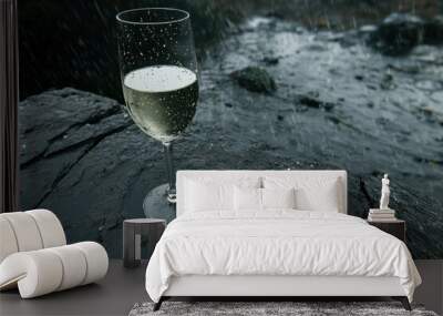 glass of sparkling wine in the rain Wall mural