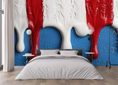 Vibrant red and blue paint splashes on a white background Wall mural