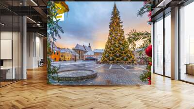 Christmas market and decorations tree in center of Brasov town, Transylvania, Romania Wall mural