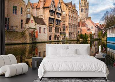 Landscape with famous Belfry tower and medieval buildings along a canal in Bruges, Belgium Wall mural