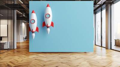 three  rocket racing on blue background for copy space Wall mural