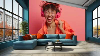 Young Woman with Headphones Smiling Wall mural