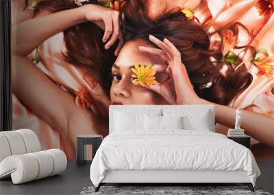 Glamour, silk and flowers by a woman with beauty and cosmetic fashion fabric for wellness, glow and skincare. Aesthetic, plants and portrait young female person with luxury elegant backdrop in spring Wall mural