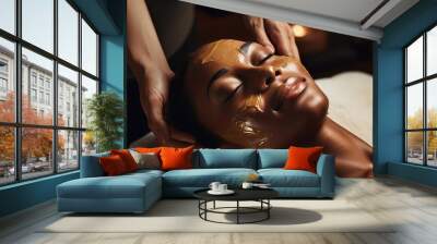 African American woman receiving a facial mask treatment at a spa to enhance her skin care routine Wall mural