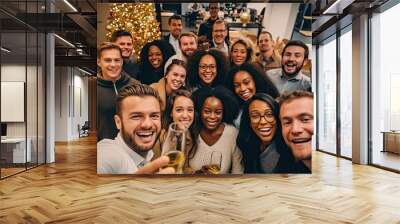 Friends at a Christmas party capture the moment with a group selfie Wall mural