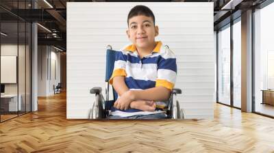 Portrait of disable kid boy on wheelchair with happy smile face Wall mural