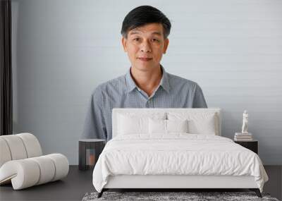 Portrait of warm personality senior older Asian man in casual dress friendly pose and looking to camera with successful feeling and self-confident Wall mural