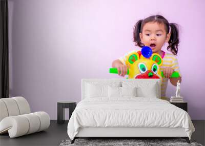 an Asian gir Kindergarten girl playing tricycle Wall mural