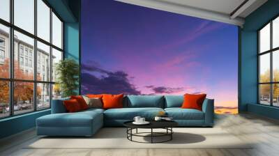 Clouds and orange sky,Real majestic sunrise sunset sky background with gentle colorful clouds without birds.Panorama, large Wall mural